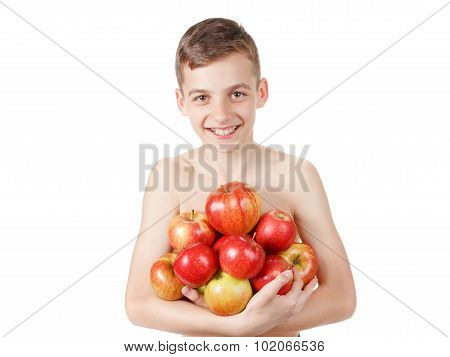 Teen boy with a pile of apples