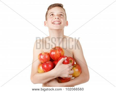 Teen boy with a pile of apples
