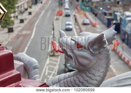 Holborn dragon close up and blurred view on the London road with ca