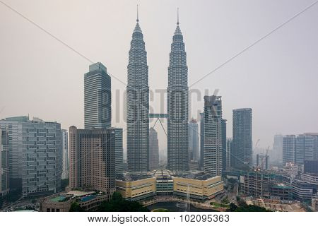 KUALA LUMPUR - SEPTEMBER 17, 2015: Smoke from forest fires in Sumatra blows across the Malay Peninsula causing haze in Kuala Lumpur City Center.