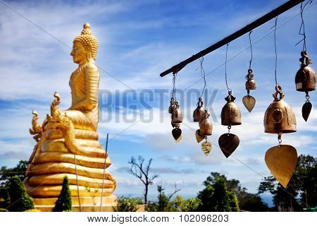 Row of golden bells in buddhist temple. big buddha in Thailand. Travel to Asia,