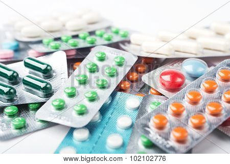 Pile Of Colorful Medicine Pills And Capsules In Blister Packs