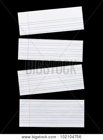 Close Up Piece Of White Lined Paper Isolated On Black