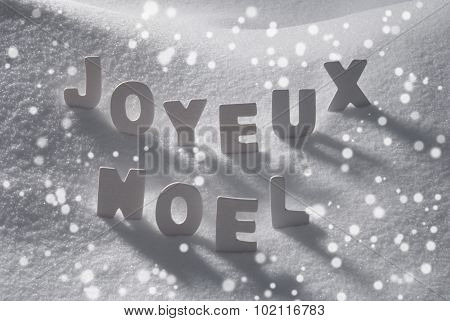 White Word Joyeux Noel Means Merry Christmas On Snow, Snowflakes