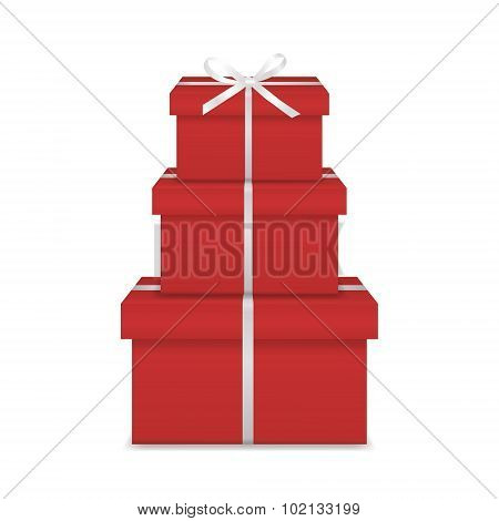 Stack of three realistic red gift boxes with white ribbon and bow