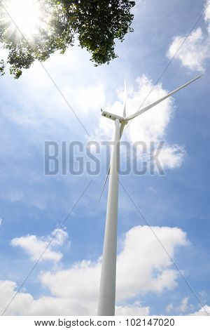 Wind Turbine Under Blue Sky - Clean Energy Genesis