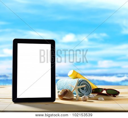 Tablet computer on sandy beach