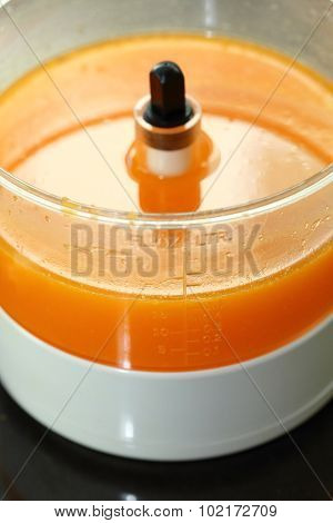 Fresh Orange Juice In Juicer Machine With Hand
