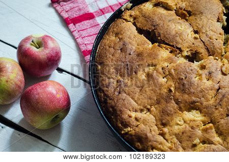 Apple pie on wooden background