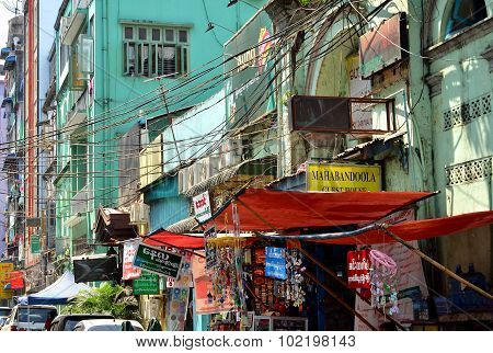 A street with local market full of wires in Yangon