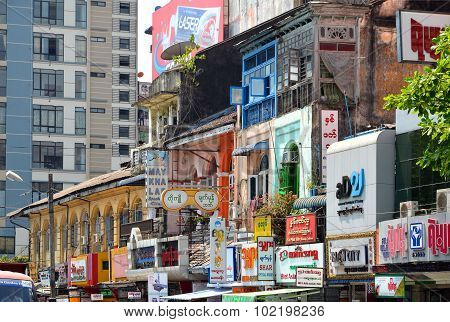 Yangon, Myanmar - March 9, 2015: A Street Archtecture View With Colonial Building In The Town Of Yan