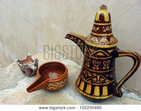 A finjan for making Arabic coffee and cup in Al Hazm Fort in Oman