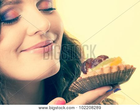Woman Closed Eyes Holds Cake In Hand