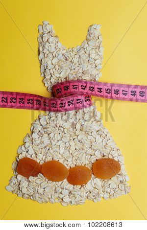 Dress Shape Made From Oatmeal With Measuring Tape
