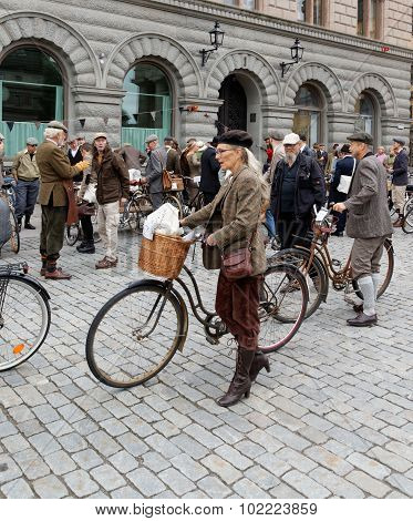 Elegant Woman Leading Her Cycle