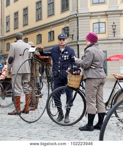 Man Leading An Very Old Bicycle And Wearing Old Fashioned Tweed Clothes