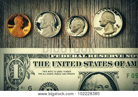New uncirculated US money over wooden background