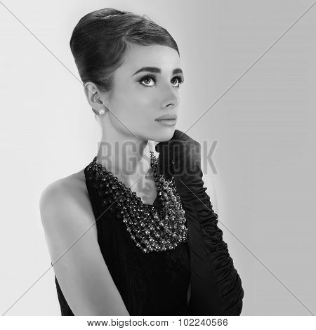 portrait of beautiful young woman in retro style . copy space.