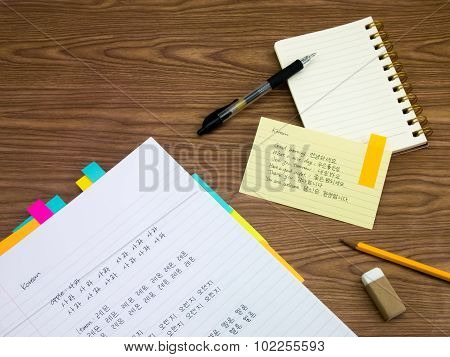 Korean; Learning New Language Writing Words On The Notebook