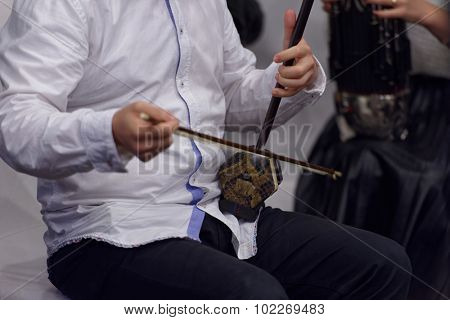 ST. PETERSBURG, RUSSIA - SEPTEMBER 14, 2015: Musician plays erhu during the press cocktail of the women's chamber orchestra 