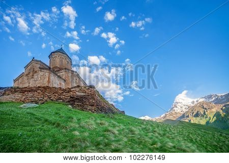 Holy Trinity Church near Mount Kazbek in Georgia. Tsminda Sameba. Mediaeval Church in mountains