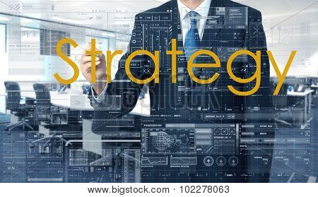 Businessman Writing On Transparent Board Strategy With Office In Background