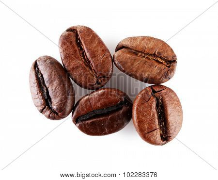 Brown coffee beans isolated on white