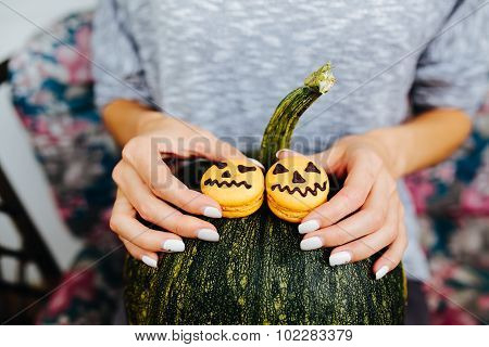 woman holding a biscuit for Halloween