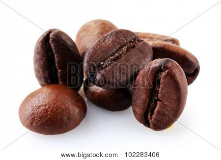 Brown coffee beans isolated on white