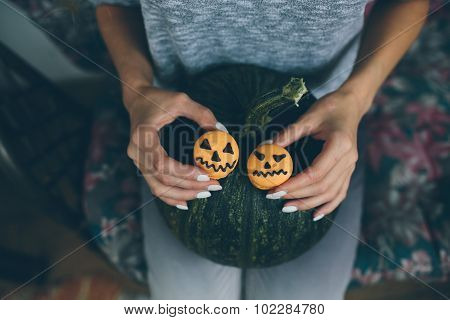 woman holding a biscuit for Halloween