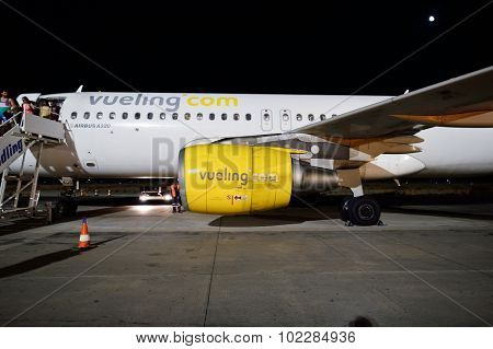 SANTORINI, GREECE - AUGUST 05, 2015: Vueling Airbus A320. Vueling Airlines, S.A. is a Spanish low-cost airline based at El Prat de Llobregat in Greater Barcelona
