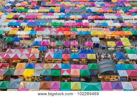 Aerial view of multiple color roof to flea market