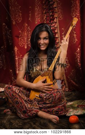 Beautiful Woman Playing The Dombra