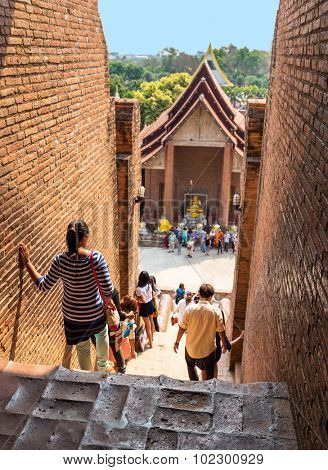 An unidentified groups of tourists and travelers in Wat Yai Chai Mongkol temple in Ayutthaya Thailand
