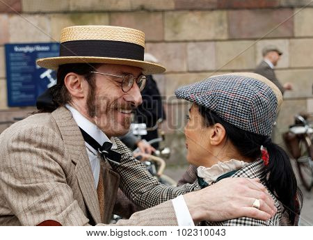 Smiling Man In Straw Hat Hugging Elegant Lady Wearing Old Fashioned Clothes