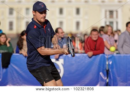 ST. PETERSBURG, RUSSIA - SEPTEMBER 12, 2015: Professional ice hockey player Alexey Ponikarovsky in the exhibition match of International tennis tournament St. Petersburg Open during City's Tennis Day