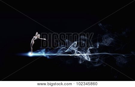 Hot young dancing woman in white bikini on dark background