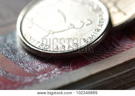 An extreme close up and details of One UAE dirham coin.