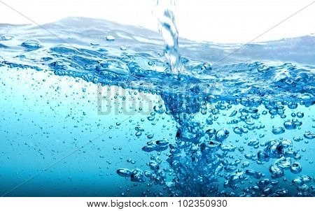 Close Up Blue Water Splash With Bubbles On White Background