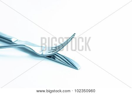 Close Up Dinning Silverware Fork , Spoon And Knife With Dish On White Background And Text Space