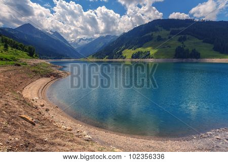 Amazing summer morning on the fantastic Speicher Durlassboden lake. Alps, Austria, Europe.