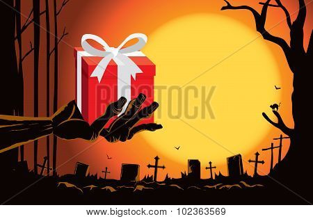 Zombie hand holding gift box at the grave
