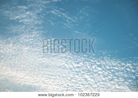 Thin white cloud over blue sky