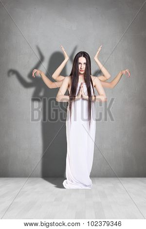 Beautiful woman with many hands