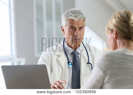 Doctor having consultation with patient in office