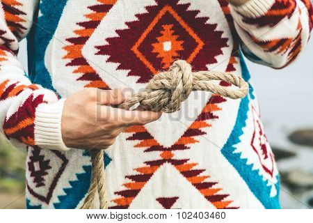 Man hands holding rope knot Travel Lifestyle
