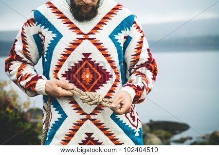 Man hands holding rope knot Travel Lifestyle survival concept