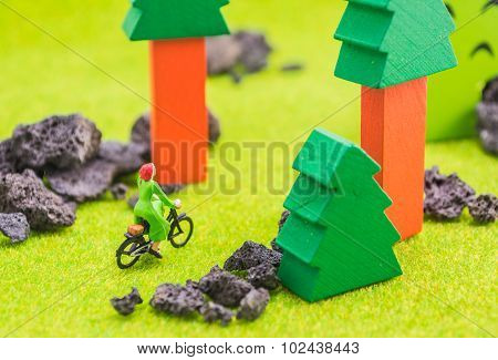 Image Of Woman(mini Figure Dolls) With Retro Bicycle Alone In A Park.