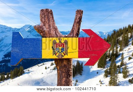 Moldova Flag wooden sign with winter background