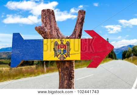 Moldova Flag wooden sign with road background